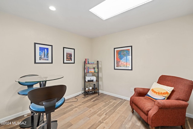 living area with light hardwood / wood-style flooring