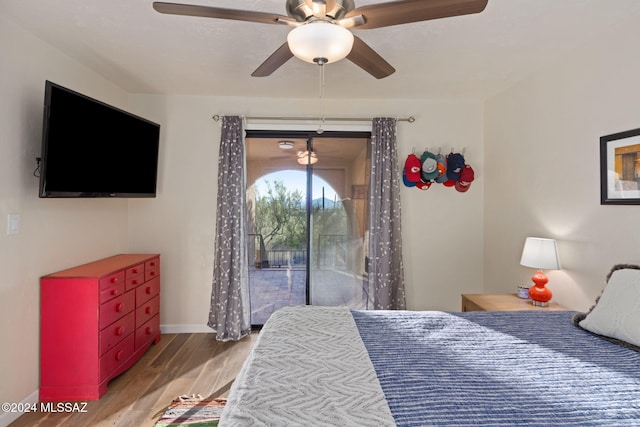 bedroom featuring ceiling fan, light hardwood / wood-style floors, and access to exterior