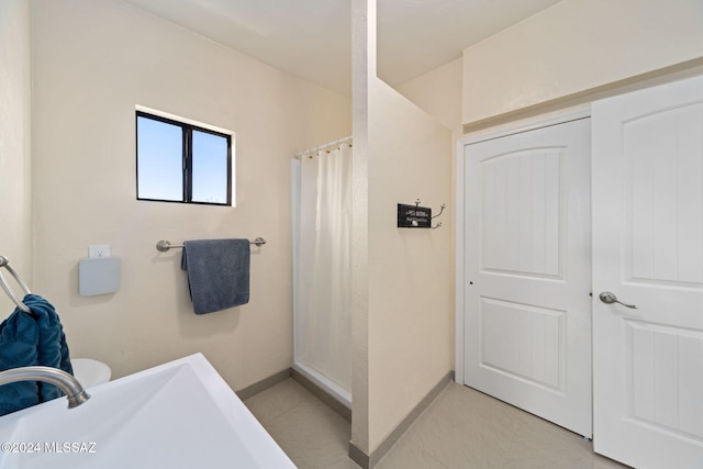 bathroom featuring sink and walk in shower