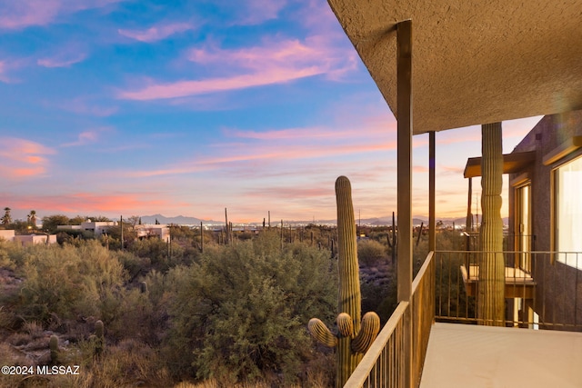 view of balcony at dusk