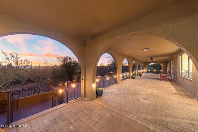 patio terrace at dusk with ceiling fan