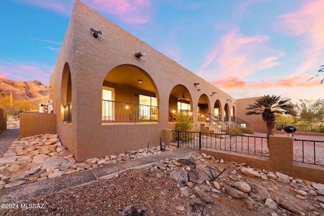 southwest-style home featuring a balcony