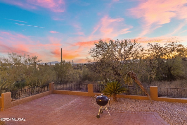 patio terrace at dusk with area for grilling