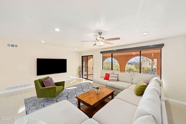 tiled living room featuring ceiling fan