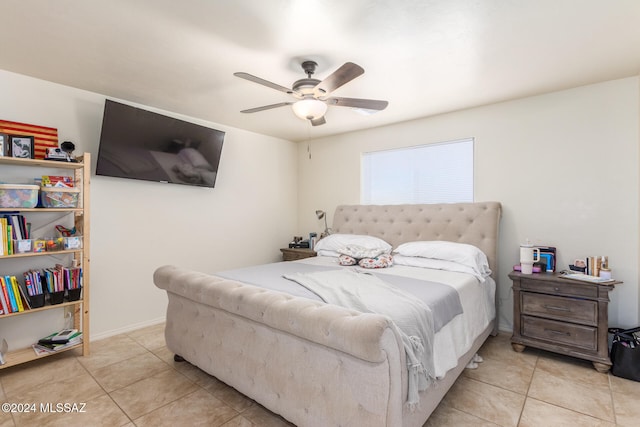 tiled bedroom with ceiling fan