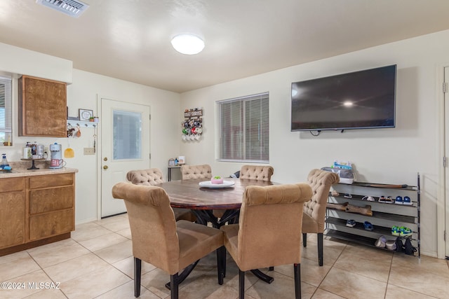 dining room featuring light tile patterned flooring