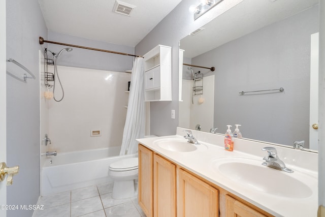 full bathroom with shower / bathtub combination with curtain, tile patterned flooring, a textured ceiling, toilet, and vanity