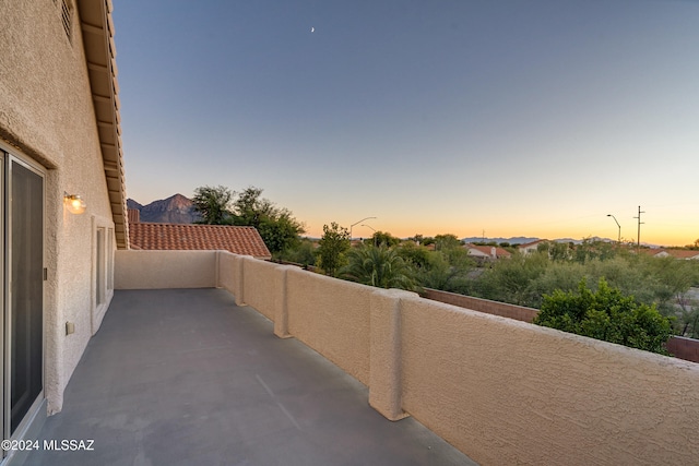 patio terrace at dusk with a mountain view