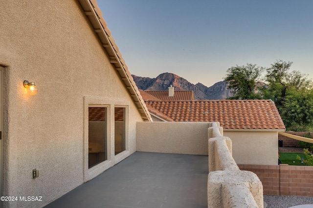 patio terrace at dusk with a mountain view