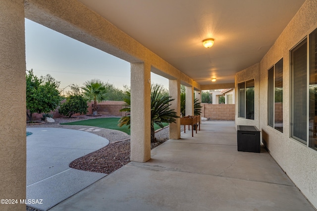 view of patio terrace at dusk