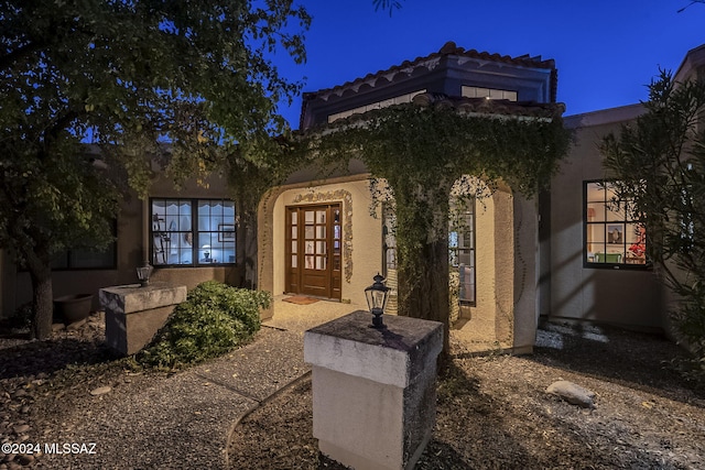 entrance to property featuring french doors