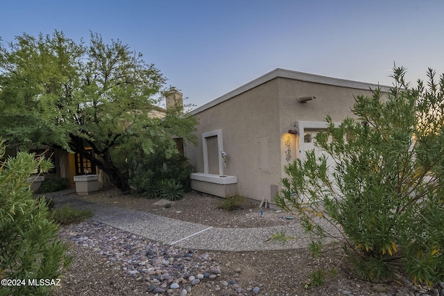 view of property exterior at dusk