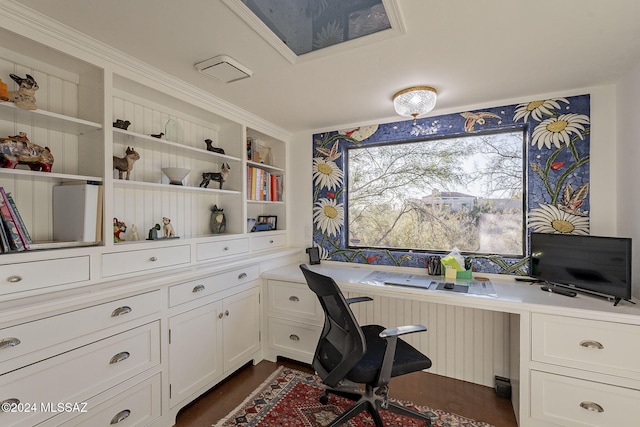 office area featuring radiator and built in desk