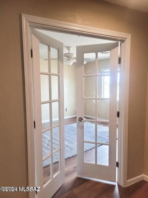 entryway featuring french doors, ceiling fan, and dark hardwood / wood-style flooring