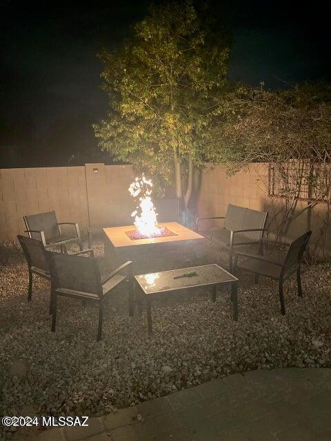 patio at night with an outdoor fire pit