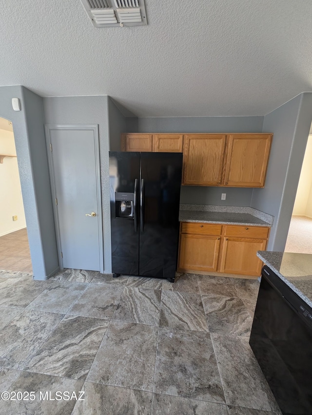 2655 W Desert Brook Ct, Tucson, AZ 85742 - kitchen with black appliances and a textured ceiling