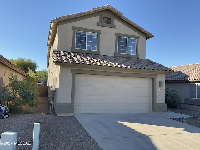 2655 W Desert Brook Ct, Tucson, AZ 85742 - view of front facade featuring a garage, stucco siding, a tiled roof, and driveway