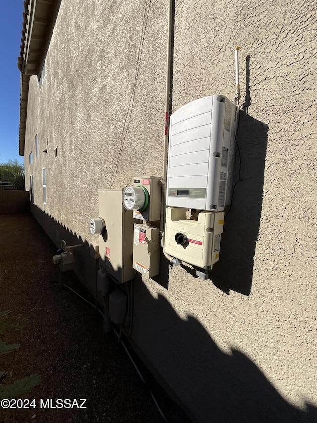 2655 W Desert Brook Ct, Tucson, AZ 85742 - exterior view of stucco siding, related energy utilities, and electric meter