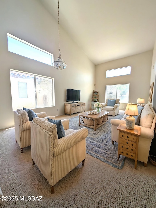 2655 W Desert Brook Ct, Tucson, AZ 85742 - living area featuring high vaulted ceiling, a chandelier, and carpet