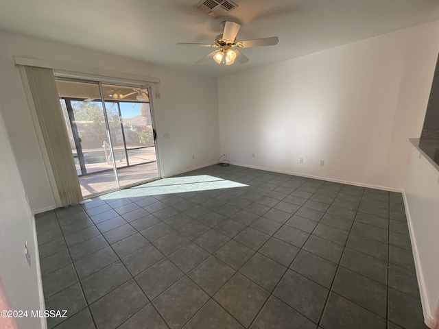 tiled empty room with ceiling fan