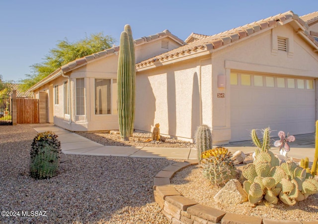 view of side of home featuring a garage