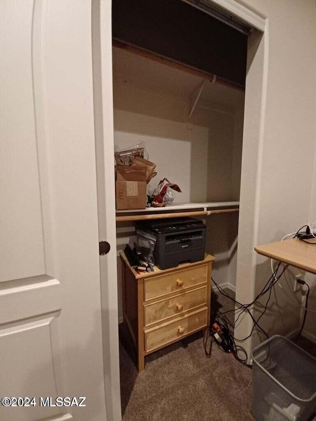 spacious closet featuring dark carpet