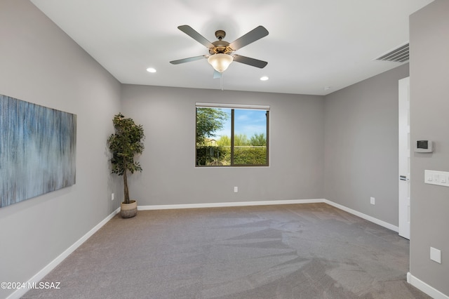 empty room with light carpet and ceiling fan