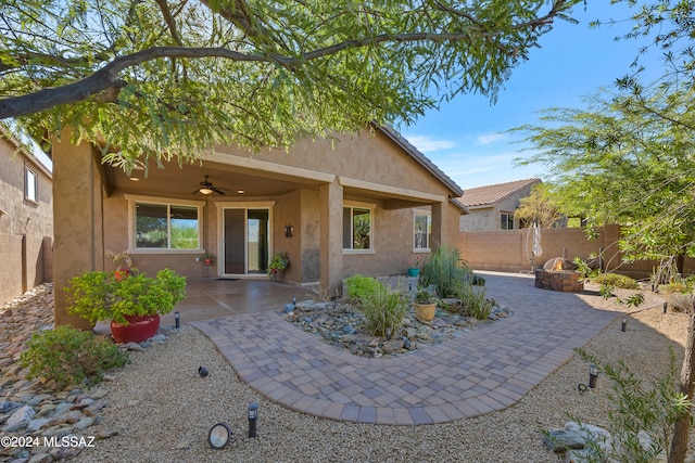 back of house with a patio area and ceiling fan