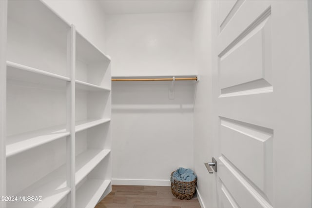 walk in closet featuring hardwood / wood-style floors