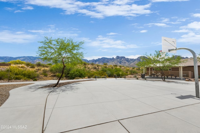 view of basketball court featuring a mountain view