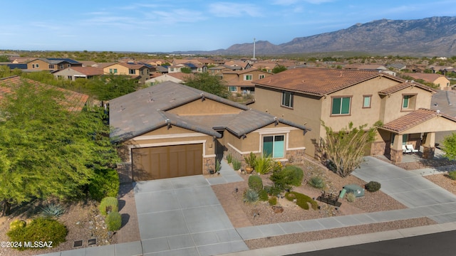 view of front of house with a mountain view and a garage