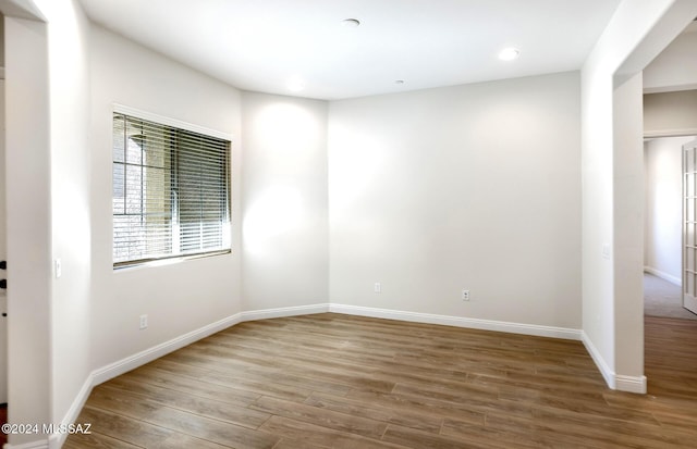 unfurnished room featuring wood-type flooring