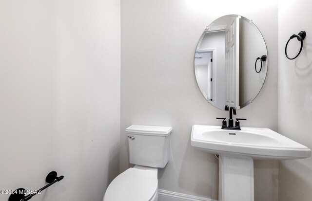 bathroom with toilet and sink