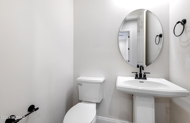 bathroom with sink and toilet