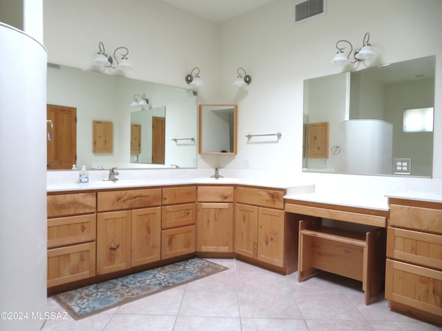 bathroom with tile patterned flooring and vanity