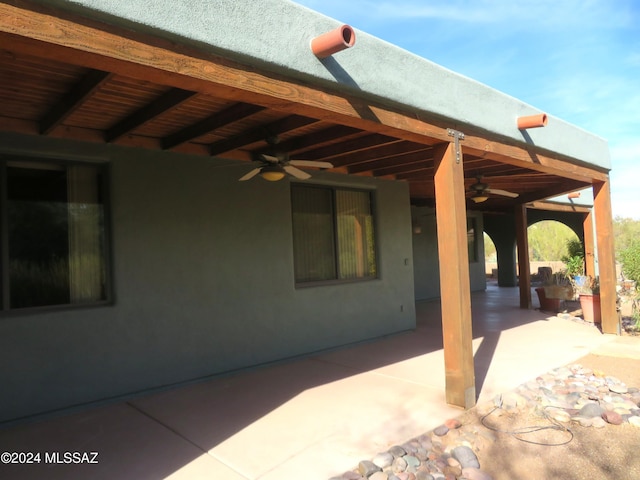 view of patio featuring ceiling fan