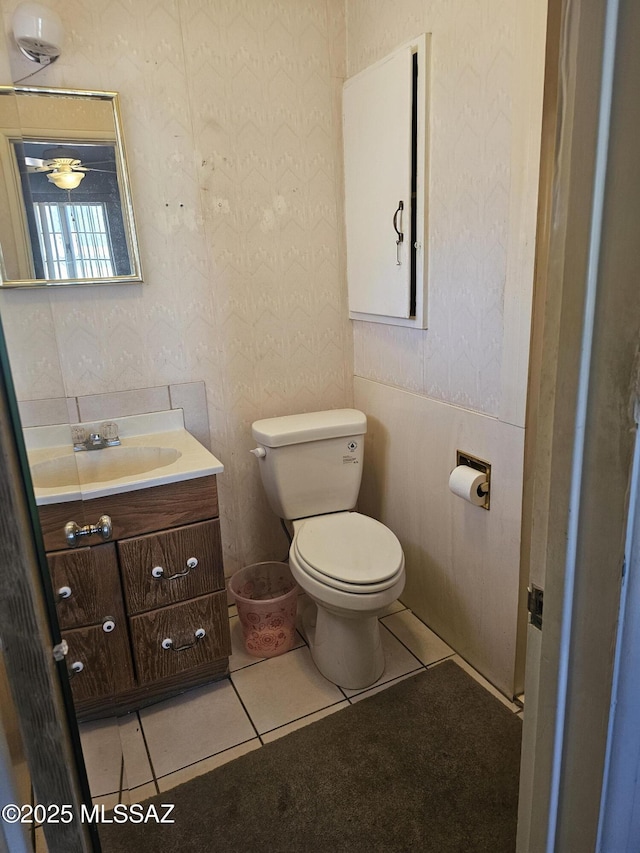 bathroom with tile patterned floors, vanity, and toilet