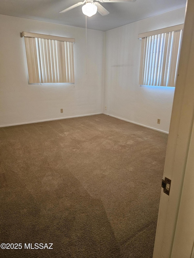 unfurnished room featuring carpet flooring and ceiling fan