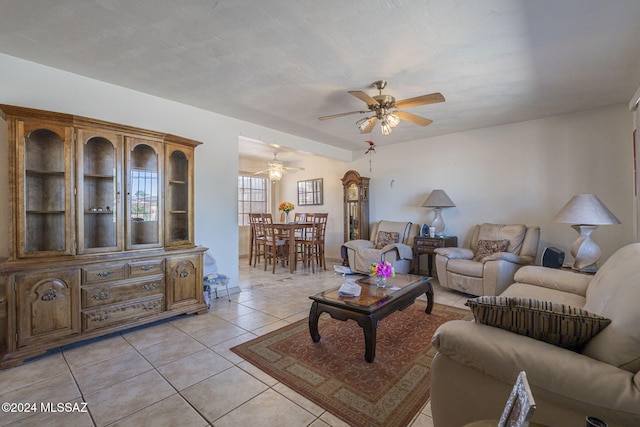 living room featuring ceiling fan and light tile patterned floors