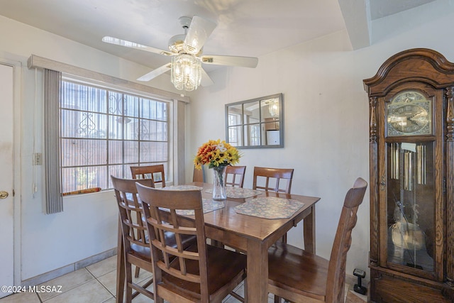 dining area with light tile patterned floors and ceiling fan