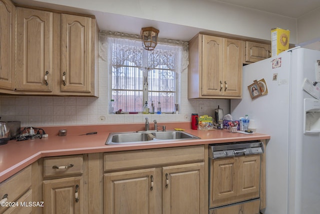 kitchen featuring paneled dishwasher, light brown cabinetry, tasteful backsplash, sink, and white refrigerator with ice dispenser