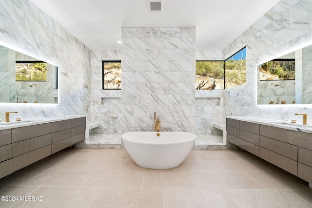 bathroom with vanity and tile walls