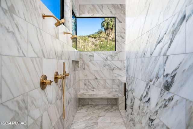 bathroom featuring tiled shower