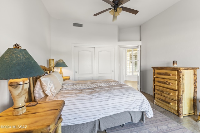 bedroom featuring ceiling fan and a closet