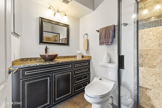 bathroom with walk in shower, vanity, and toilet