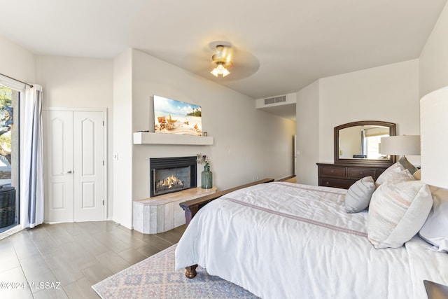 bedroom with multiple windows, a closet, and ceiling fan