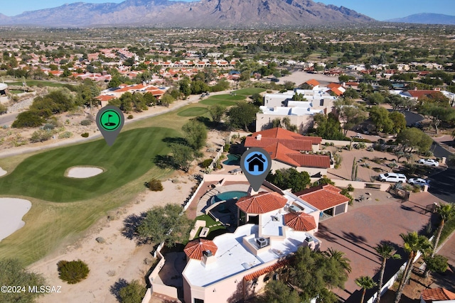 birds eye view of property with a mountain view