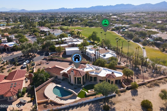 birds eye view of property featuring a mountain view