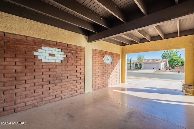 view of patio / terrace featuring a garage