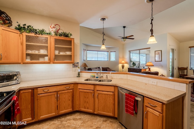 kitchen featuring sink, kitchen peninsula, ceiling fan, lofted ceiling, and dishwasher